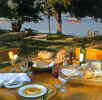 Amanwana - Dining by the sea
