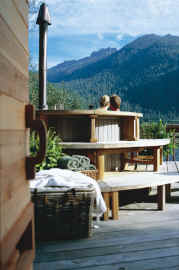 Clayoquot Wilderness Resorts - Outpost Spa - Outdoor hut tub view from inside sauna
