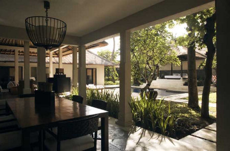 Outdoor villa dining room with private pool